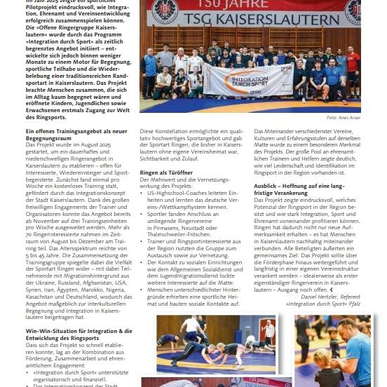 Gruppenfoto von Teilnehmern der offenen Ringerguppe KL mit Plakat zum 150-j&auml;hrigen Bestehen der TSG Kaiserslautern.